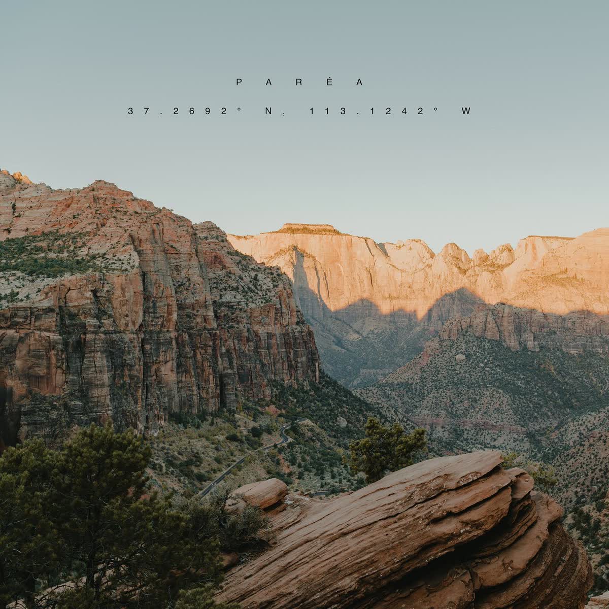 Golden-hour light across the canyons of Zion National Park, seen from the Paréa land